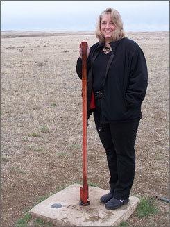 The Center of the Nation is located 20.8 miles north of Belle Fourche, S.D. The Belle Fourche Chamber of Commerce has been raising money for the past eight years hoping to build a monument to better showcase the Center of the Nation. The red pole on a cement pad is the only marker at this time. It can hardly be seen from the road.